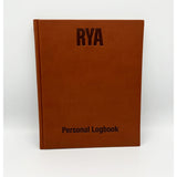 The Royal Yachting Association's RYA Personal Logbook, a brown hardcover, stands upright against a white background—ideal for documenting your journey as a Coastal Skipper or Yachtmaster.