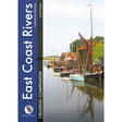 The cover of Fernhurst Books' "East Coast Rivers Cruising Companion" features sailboats on a tranquil river, with trees and red-roofed buildings, and the title is displayed vertically on a blue banner.