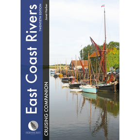 The cover of Fernhurst Books' "East Coast Rivers Cruising Companion" features sailboats on a tranquil river, with trees and red-roofed buildings, and the title is displayed vertically on a blue banner.