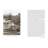 The left page of "Barging up the Wye" by Logaston Press shows a black-and-white photo of an old wooden boat at the shore with trees and a house; the right page presents text on River Wye history and early barge traffic.
