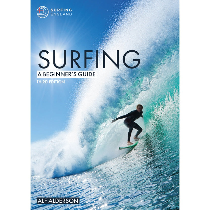 Cover of "Surfing: A Beginner's Guide" by Fernhurst Books shows a surfer inside a turquoise wave under a clear blue sky—perfect inspiration for anyone starting their surfing journey with this top beginner’s guide.