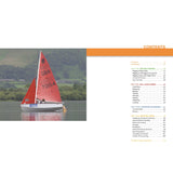 A Mirror dinghy with red sail number 70154 glides across a lake with green hills, while on the right is the table of contents for "Mirror Book" by Fernhurst Books, a learn to sail guide.