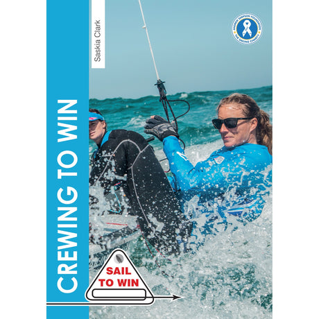 Two women sail in choppy waters, both in blue jackets and sunglasses, showing Olympic crew teamwork. One holds a rope and leans over the side. Text: "CREWING TO WIN"—Crewing To Win by Fernhurst Books. "SAIL TO WIN.