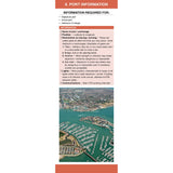 A marina with many boats docked beside a town, shown in Fernhurst Books’ Passage Planning Companion’s “Port Information” guide section, which covers pilotage, port/anchorage details, restrictions, weather, lights, and communication notes.