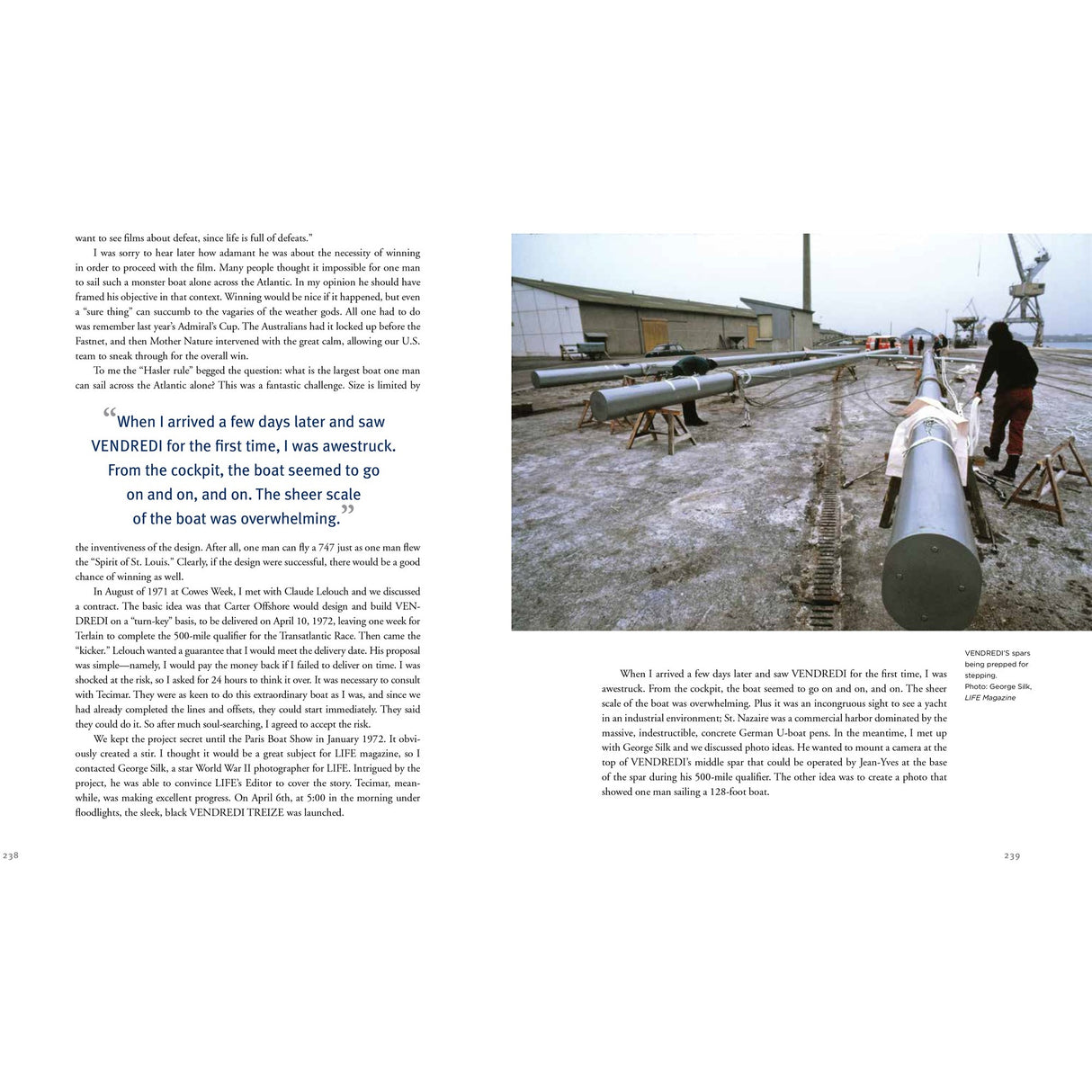 In an industrial dock dusted with snow, two people work on a long sailboat mast amid warehouses and cranes—an image reminiscent of Dick Carter: Yacht Designer by Fernhurst Books.