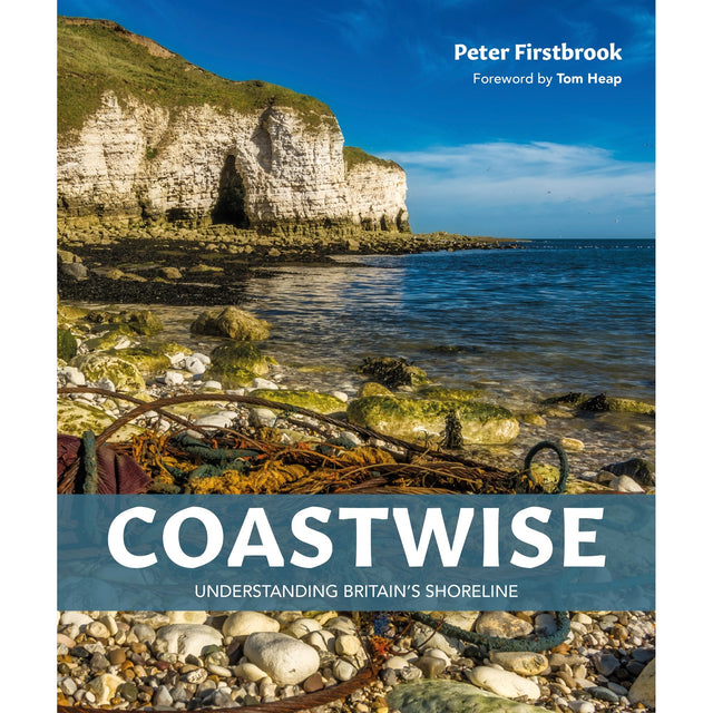 The cover of "Coastwise" by Fernhurst Books depicts Britain’s coastline with seaweed, pebbles, and white cliffs under a blue sky. Authored by Peter Firstbrook with a foreword by Tom Heap.