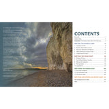 The cover of Coastwise by Fernhurst Books shows a dramatic British cliff above a rocky beach at sunset, with a table of contents for the coastal environment book featuring section titles and page numbers to the right.