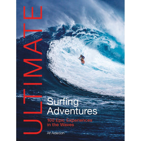 A surfer rides a huge blue wave on the cover of "Ultimate Surfing Adventures" by Fernhurst Books, framed by bold red and white text that captures the excitement of epic surf travel and top surfing spots worldwide.