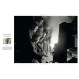 Five men sit around a glowing stove in a dimly lit, smoky interior in this photograph from The Endurance Photographs by Riverside Press.