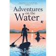 Book cover for "Adventures on the Water" from Vertebrate Publishing features silhouettes of two people stand-up paddleboarding on a calm sunset lake, with mountains and birds in the background.
