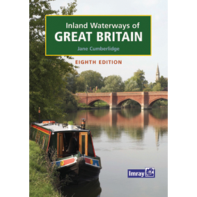 Cover of "Inland Waterways Of Great Britain" by Imray, showing a canal boat on a river with a brick bridge and trees—a key navigation guidebook for exploring England's waterways.