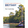 Cover of the book titled "Secret Anchorages of Brittany" by Peter Cumberlidge, published by Imray. The cover features a serene scene of a sailboat anchored near a forested shoreline with lush green trees under a clear sky, showcasing the natural anchorages.