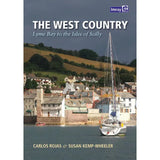 Cover of the book "West Country" by Carlos Rojas and Susan Kemp-Wheeler, from Imray. This vibrant cruising guide features a coastal town with buildings and lush hills in the background, alongside a sailboat in the calm harbor under gray skies.