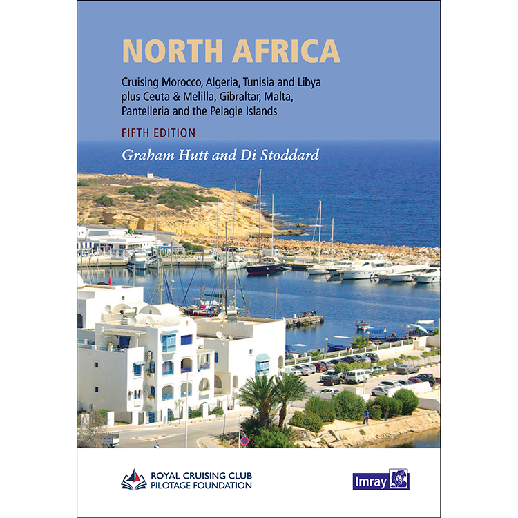 Cover of "North Africa" by Imray, authored by Graham Hutt and Di Stoddard. This cruising guide spans Morocco, Algeria, Tunisia, Libya, Ceuta & Melilla, Gibraltar, Malta, Pantelleria, and the Pelagie Islands. The cover image features a coastal marina lined with boats and buildings near the shore—perfect launching points along the Moroccan coastline.