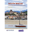A red and white sailboat rests by the shore of a Spanish town with mountains behind. The cover reads: "South Biscay" by Steve Pickard, Eighth Edition—your South Biscay pilot from Imray.