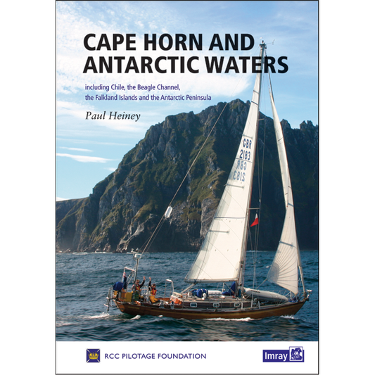 Book cover of "Cape Horn and Antarctic Waters" by Paul Heiney, published by Imray. It depicts a sailboat navigating the water with towering, rocky cliffs in the background. Keywords like Cape Horn, Falkland Islands, and Antarctic Peninsula are featured beneath the title.