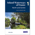 Book cover for "Inland Waterways of France Volume 1: North and Centre" by Imray features a canal boat on calm French waterways, surrounded by lush green trees under a partly cloudy sky.