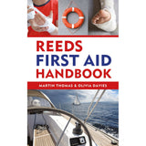 Cover of "Reeds First Aid Handbook" by Martin Thomas & Olivia Davies. This essential guide for first aid in the marine environment, ideal for boaters, features images such as a bandaged hand, an arm being wrapped, a life ring, and a sailboat on the water.