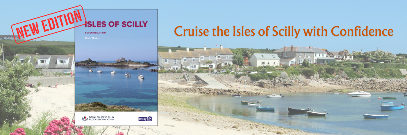 Book cover image for "Isles of Scilly, Seventh Edition" by David Buck. The scenic background shows a coastal village with boats in the water and houses along the shore. Text reads "Cruise the Isles of Scilly with Confidence.