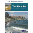 Cover of the book "Black Sea" by David Read Barker and Lisa Borre, published by Imray and the RCC Pilotage Foundation. The cover features an image of a coastal area with rough waves hitting a rocky shore, and houses on a hillside under a blue sky. This makes it ideal for those seeking sailing directions.