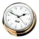 The Weems & Plath Brass Endurance 125 Clock radiates nautical elegance with its white face, black numerals, and a 24-hour time indicator. "Weems & Plath" is gracefully printed at the center. It proudly shows the time as 12:04 while combining stylish aesthetics with weather-resistant construction.