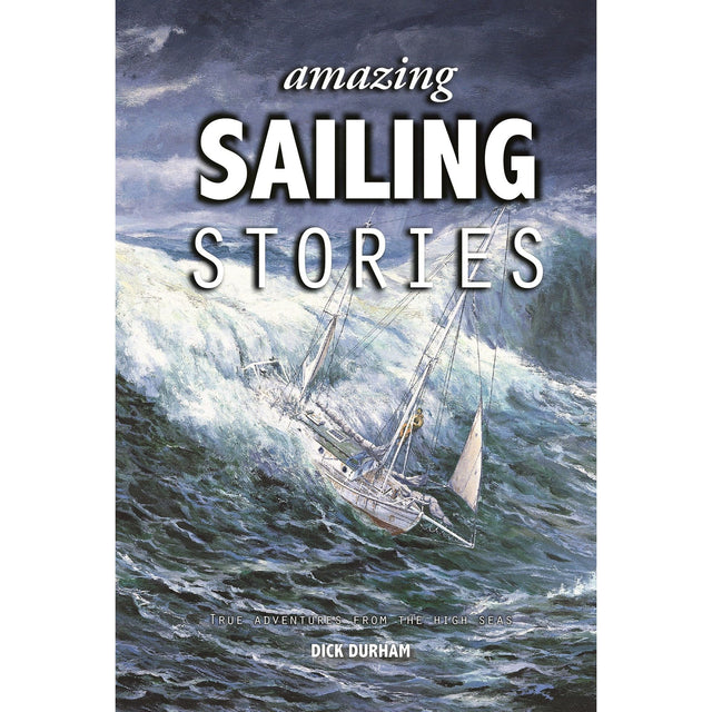 The cover of Fernhurst Books' "Amazing Sailing Stories" shows a sailboat braving stormy seas and large waves under cloudy skies. The subtitle, "True Adventures from the High Seas," promises thrilling maritime tales for sailing enthusiasts.