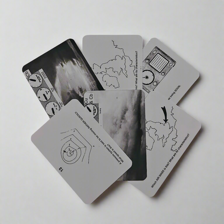 A spread of five black and white Flip Cards - Meteorology by Flip Cards, each featuring unique illustrations and text. Three cards display maps with arrows pointing to specific regions to reflect wind forces. One card showcases a radar-like circular graphic, while another features an image of a meter and dial. The background is plain white.