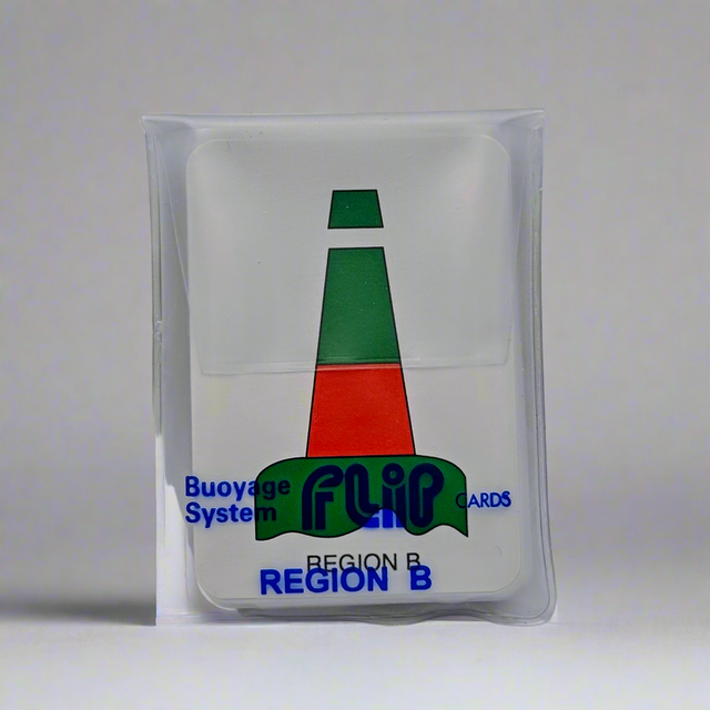 A card from Flip Cards - IALA Bouyage (Region B), encased in a clear plastic sleeve. The card features an image of a tall, conical buoy with green at the top and bottom and a red middle section. The text on the card reads "Buoyage System," "FLIP CARDS," and "REGION B." It's an excellent tool for understanding navigational markers and buoyage rules.