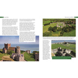 A two-page spread in "Coastwise" by Fernhurst Books showcases castles along the British coastline in lush landscapes, with text detailing their architecture, significance, and geological influences on these medieval structures amid scenic views.