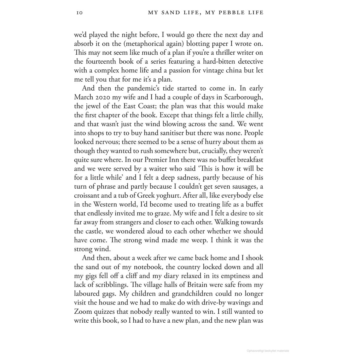 A page from "My Sand Life, My Pebble Life," a book by Adlard Coles, explores the impact of the pandemic on travel plans and evokes feelings of seaside nostalgia. It references March 2020 in Scarborough on the East Coast and mentions Premier Inn while reflecting on canceled trips and imagining a simpler lifestyle without the typical buffet breakfast associated with family holidays.