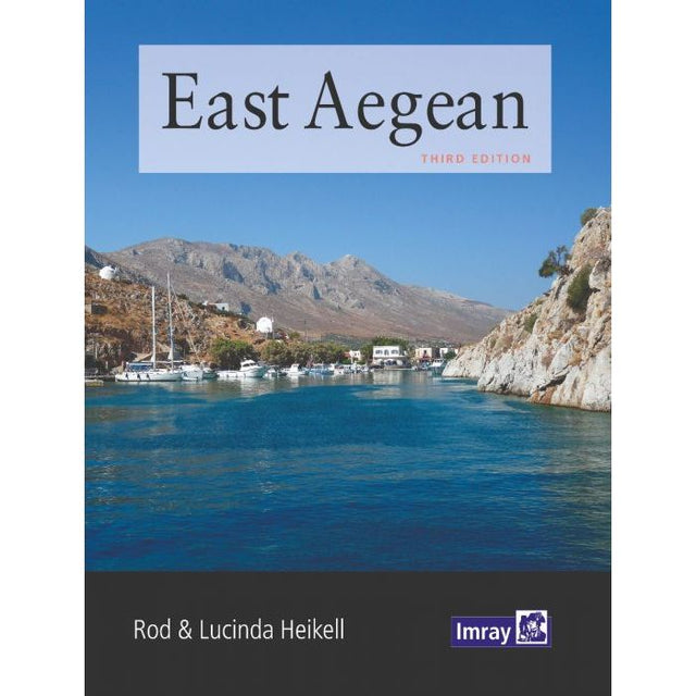 The cover of the book "East Aegean" by Rod and Lucinda Heikell features a serene coastal scene with clear blue waters, rocky shores, and small white buildings under a clear sky, capturing the essence of the Dodecanese islands. The Imray logo is at the bottom.