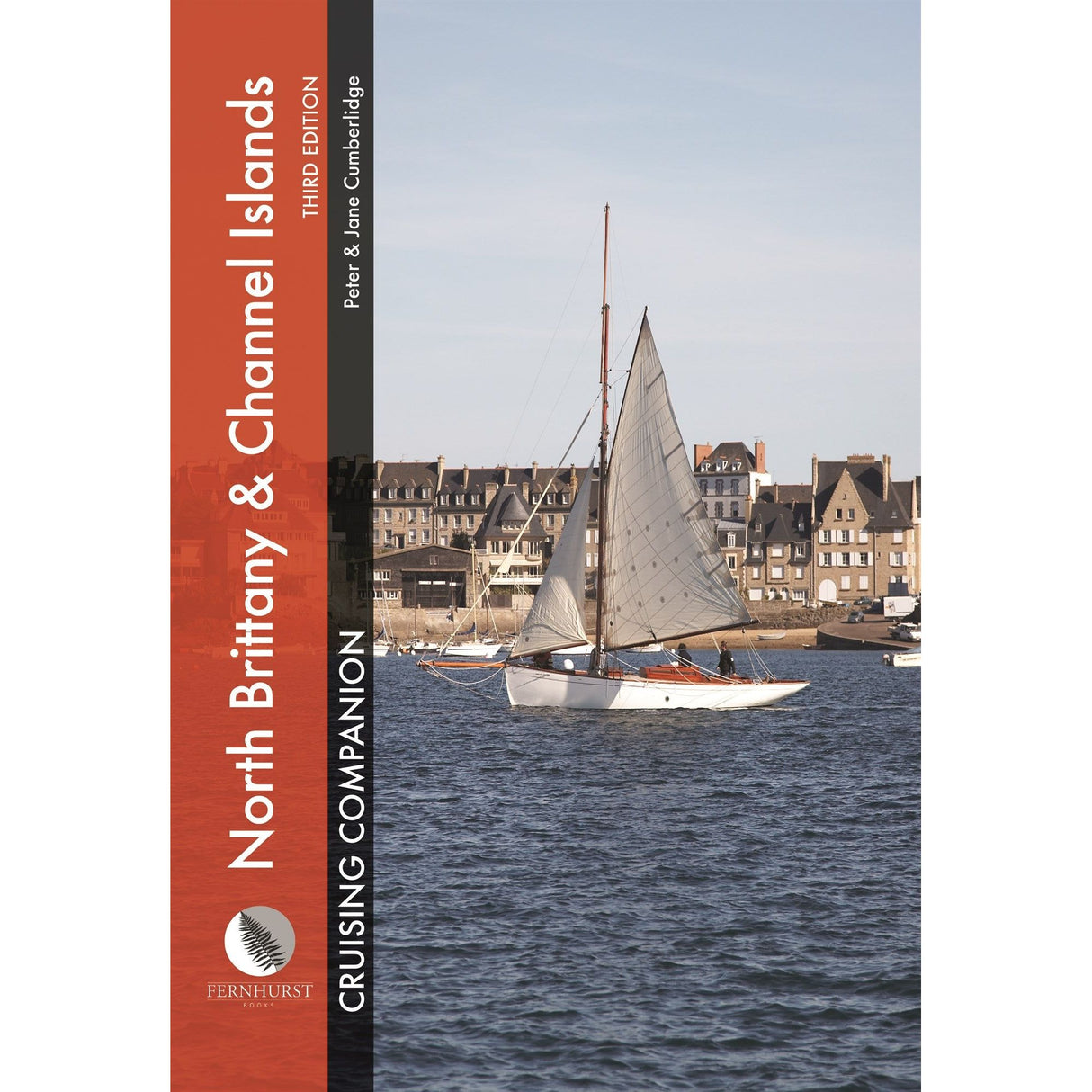 Cover of Fernhurst Books' "North Brittany & Channel Islands Cruising Companion" with a sailboat on calm water, a coastal town backdrop, and an orange vertical banner on the left, providing crucial pilotage details for sailing in Northern Brittany and the Channel Islands.