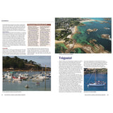 A travel magazine showcases two locations: Ploumanac’h on the left with a charming coastal town, and Trégastel on the right with rocky coastline views. Both pages invite adventures featured in Fernhurst Books’ North Brittany & Channel Islands Cruising Companion.