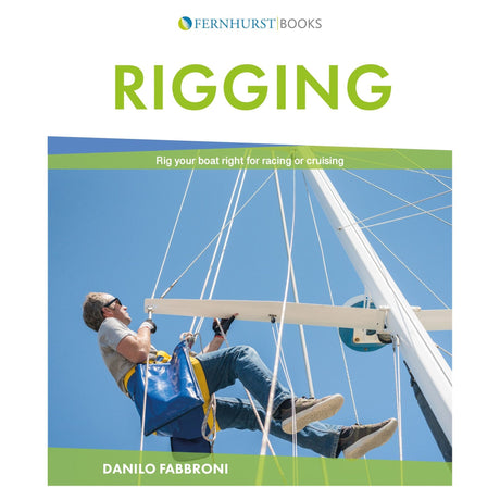 The cover of "Rigging," authored by Danilo Fabbroni and published by Fernhurst Books, depicts a sailor in a harness diligently attending to sailboat rigging under a bright blue sky.