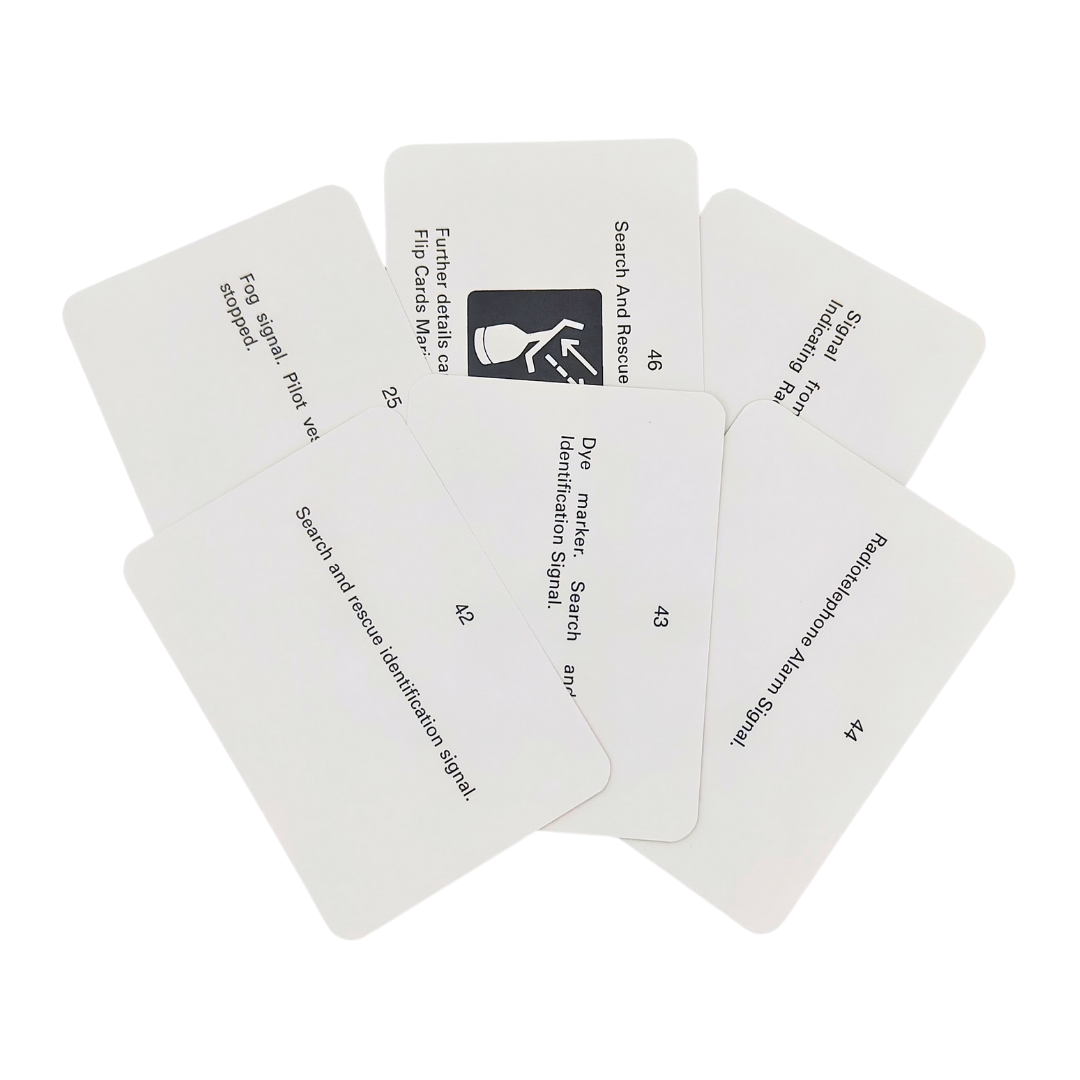 A set of six white Flip Cards: Sound and Light Signals is arranged in a spread. One card is flipped over, revealing an illustration with the title "Search And Rescue Identification Signal," crucial for the maritime industry. The remaining cards have text on them but are partially obscured.