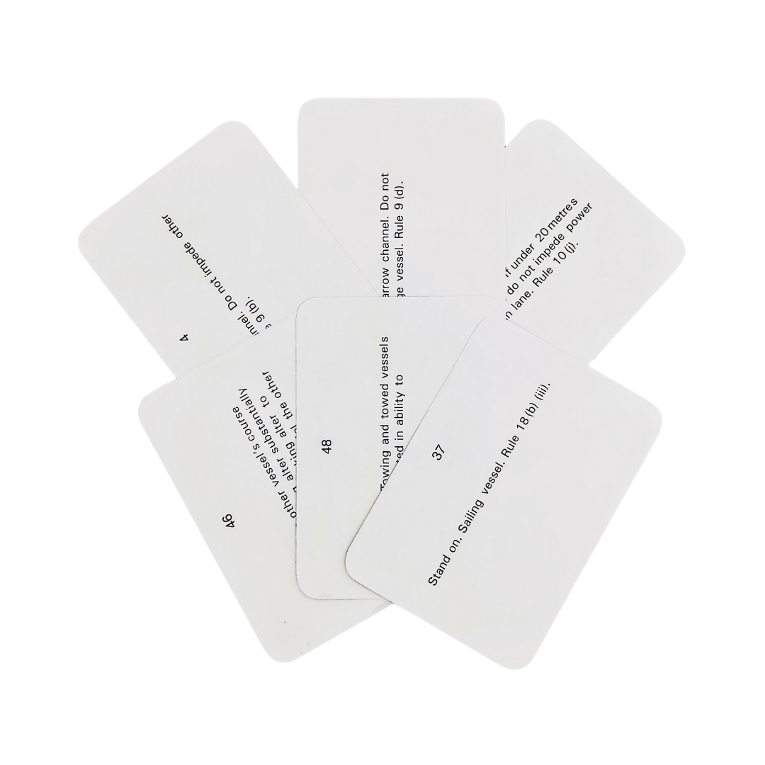 A set of six white rectangular cards from the Flip Cards: Rule of the Road collection by Flip Cards lies flat on a surface. Each card features black text detailing a different rule or instruction similar to Col Regs for managing traffic situations, and they are arranged with slight overlap in a neat circular pattern.