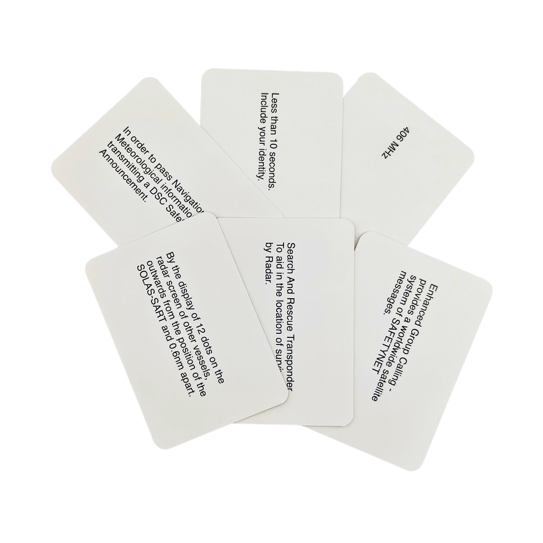 White flip cards, part of the Flip Cards: GMDSS Marine Radio series by Flip Cards, are scattered with black printed text showcasing diverse messages pertinent to survival, rescue, and identification. Arranged in a fan-like pattern on a white background, they evoke the appearance of the General Operators Certificate used in maritime safety.