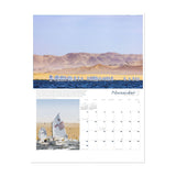 The Ultimate Sailing 2025 Calendar from Sharon Green encapsulates a breathtaking scene of sailboats racing across the sea in November, set against a backdrop of desert dunes and birds. Below, the calendar features Sharon Green's detailed close-up images of sailboats surrounded by dunes and water, enhancing the calendar grid's displayed dates.