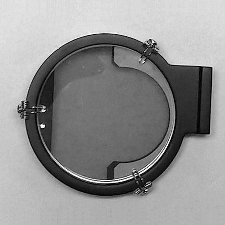 A Celestaire Astra IIIB Deluxe Sextant by SailorShop, featuring a sleek black circular frame with a glass center, is secured by four metallic clasps at the cardinal points and mounted against a simple, light-colored background.