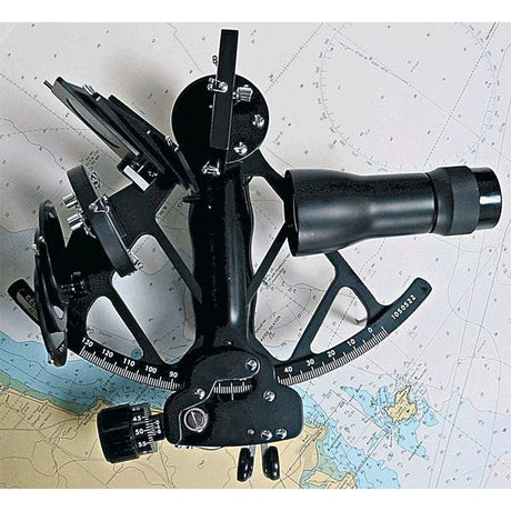 A Celestaire Astra IIIB Deluxe Sextant by SailorShop elegantly rests on a nautical chart, exhibiting its finely crafted telescope and precise angular components for celestial navigation. The background, adorned with intricate maritime markings, underscores the accuracy of this metal sextant.