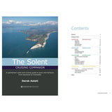 The image showcases the book cover of "Solent Cruising Companion" from Fernhurst Books by Derek Aslett, featuring an aerial view of a coastline and contents that include pilotage information, harbour guides for the Western, Central, and Eastern Solent, along with its regional history.