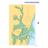 A map of Namley Harbour, designated as a standard port and perfect for training purposes, is included. It features water channels, tan land areas, green vegetation, and maritime symbols. A blue compass is positioned at the top-center of the map, making it an ideal companion to the Royal Yachting Association's RYA Training Almanac - Northern Hemisphere.