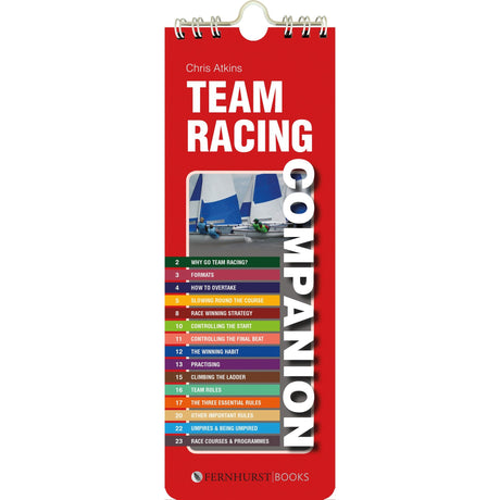 A book cover in red titled "Team Racing Companion," published by Fernhurst Books and authored by Chris Atkins, showcases a sailboat image alongside a list of contents that includes topics such as sailing techniques, racing strategy, and team roles.