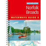 Cover of Nicholson Waterways Guide 8: Norfolk Broads by Nicholson features colorful boats on a river in Broads National Park, lush greenery, a blue sky with clouds, and part of a detailed inland waterways guide map at the bottom edge.